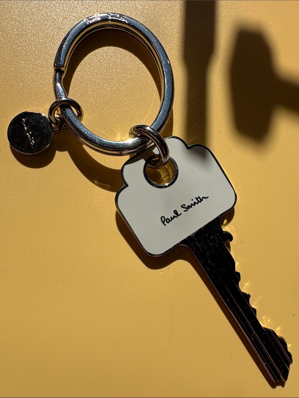 Paul Smith White Enamel Key Charm with Silver Hardware